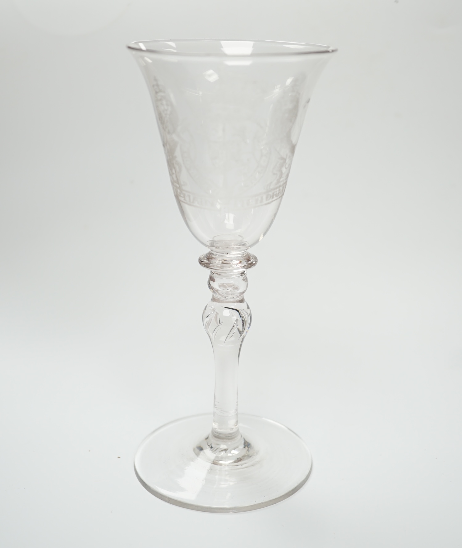 An 19th century diamond point engraved armorial glass, with knopped stem, air tears and rough pontil, 18cm